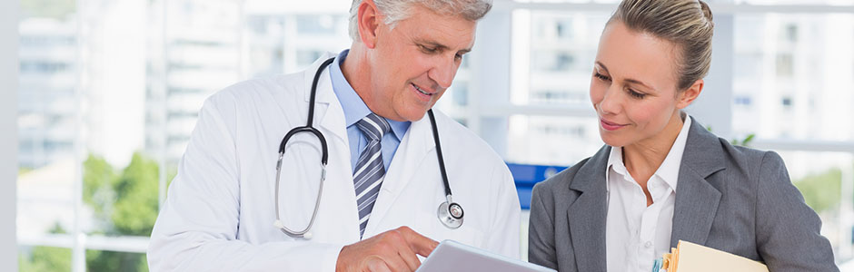 doctor and woman look at test results with happiness